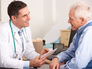 elderly man consulting doctor